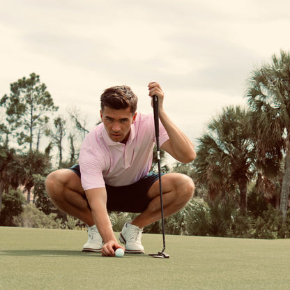 Golfer on putting green wearing the Murray Shirt